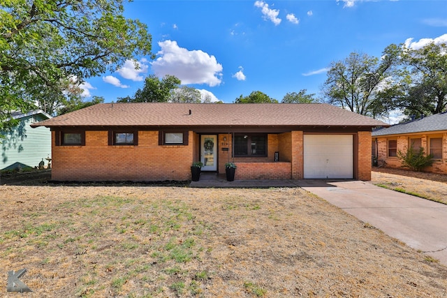 single story home featuring a garage