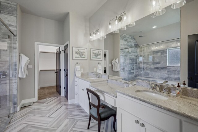 bathroom with parquet floors, vanity, and a shower with shower door