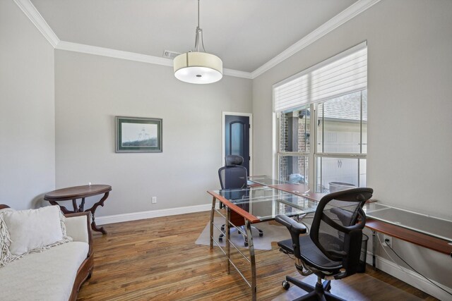 office area with dark wood-type flooring and ornamental molding