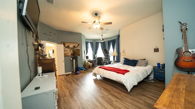 bedroom with hardwood / wood-style floors and ceiling fan