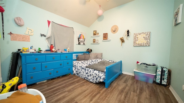 bedroom featuring vaulted ceiling and dark hardwood / wood-style floors