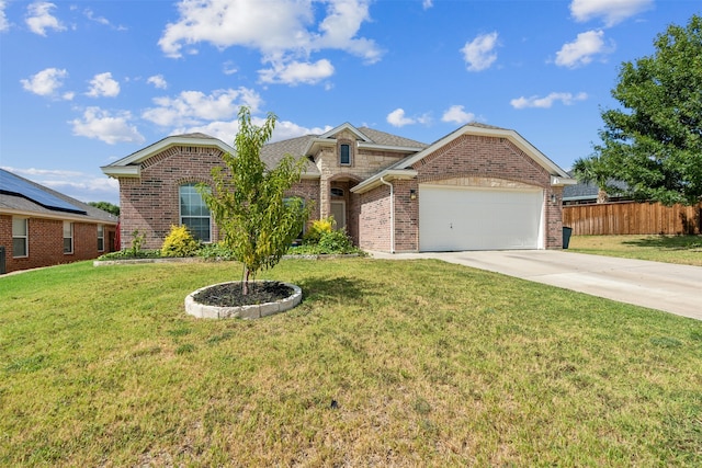 ranch-style home featuring a garage and a front lawn