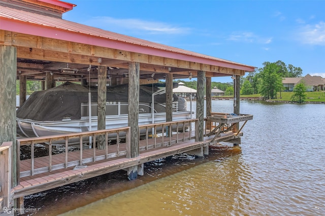 dock area featuring a water view