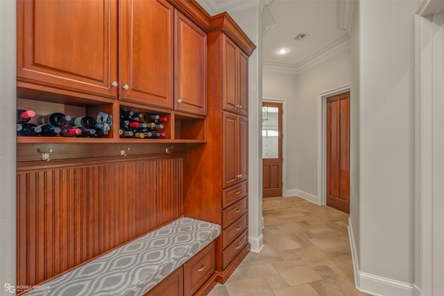 mudroom featuring crown molding