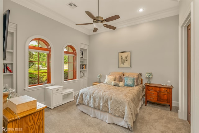 bedroom featuring ceiling fan, ornamental molding, and light carpet