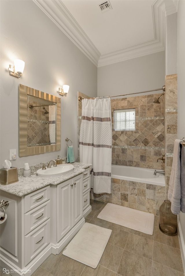 bathroom featuring tile patterned floors, vanity, ornamental molding, and shower / tub combo with curtain