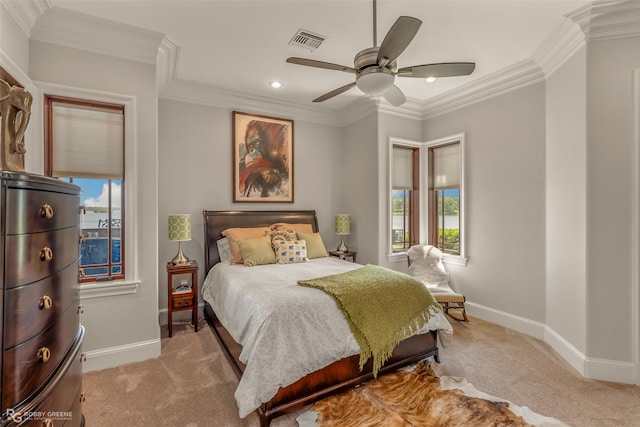 bedroom with multiple windows, ceiling fan, and ornamental molding