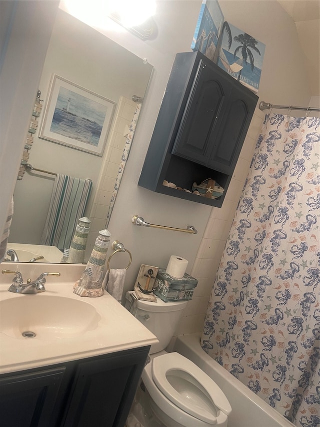 full bathroom featuring tile patterned floors, shower / bathtub combination with curtain, toilet, and vanity