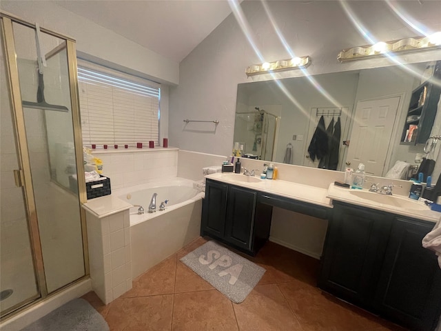 bathroom featuring lofted ceiling, vanity, tile patterned flooring, and shower with separate bathtub