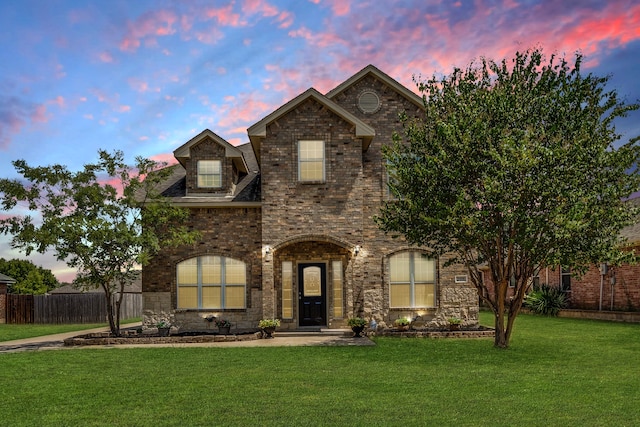 view of front of house with a lawn