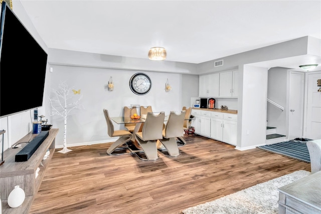 dining area with light wood-type flooring