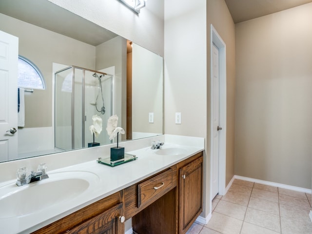 bathroom featuring vanity, walk in shower, and tile patterned floors