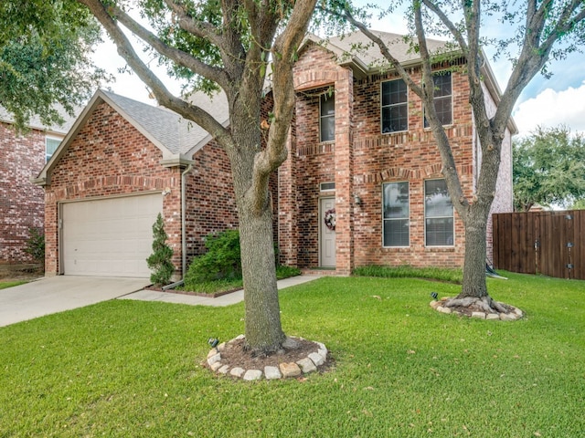 view of front of home featuring a front lawn and a garage