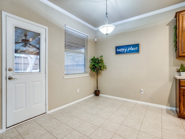 unfurnished dining area with crown molding and light tile patterned floors