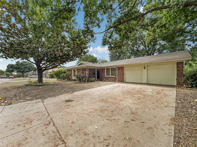 single story home with a garage