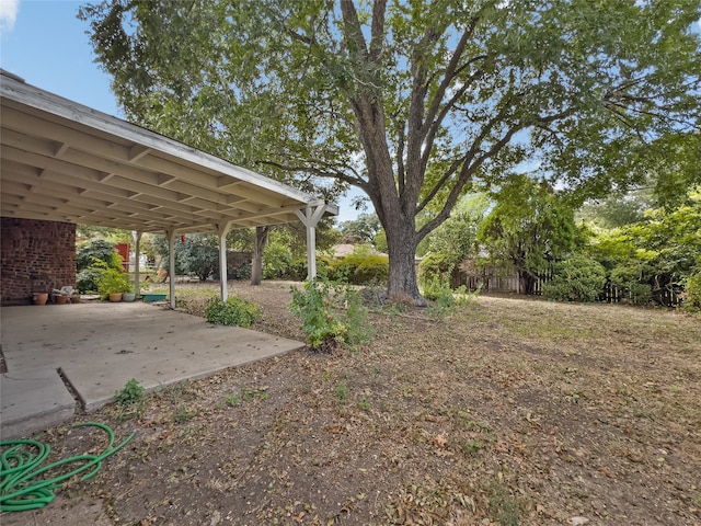 view of yard with a carport