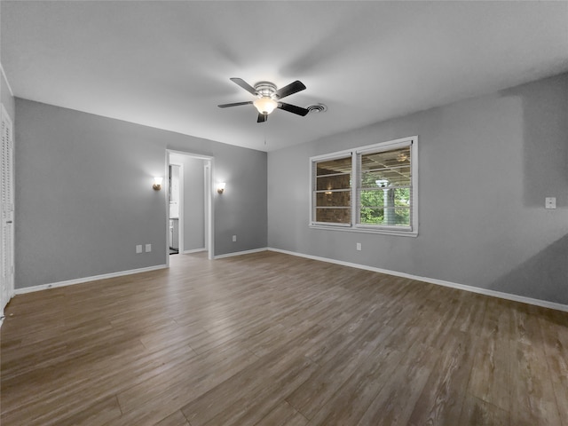 unfurnished room with wood-type flooring and ceiling fan