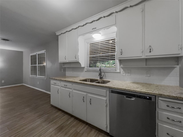 kitchen featuring white cabinets, light stone countertops, sink, wood-type flooring, and stainless steel dishwasher