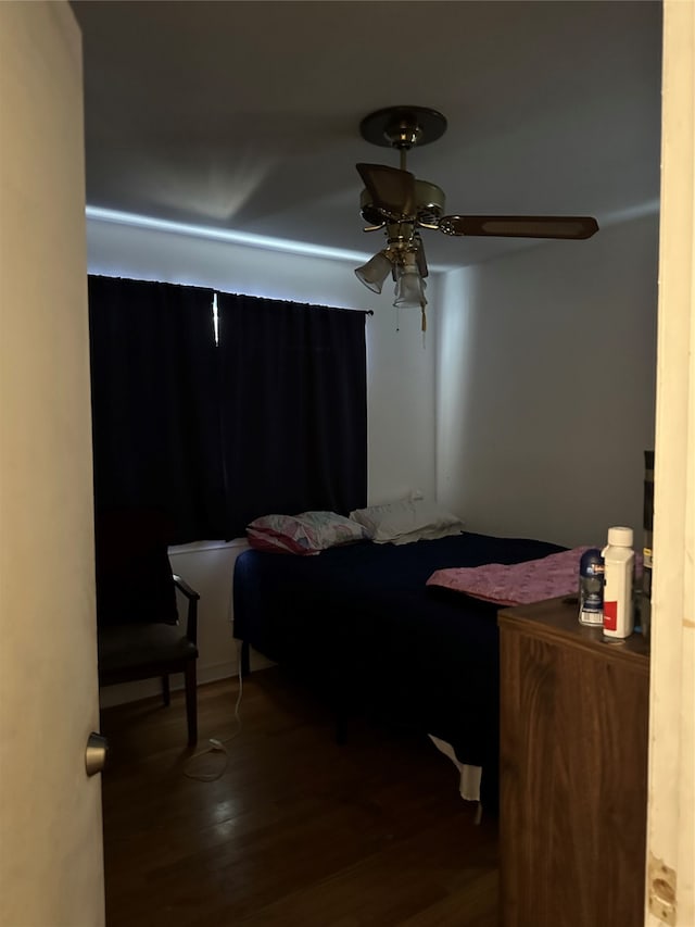 bedroom featuring ceiling fan and wood-type flooring