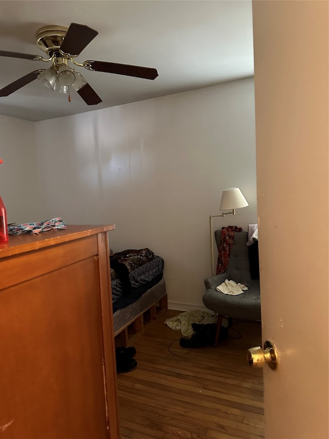 unfurnished bedroom featuring hardwood / wood-style flooring and ceiling fan