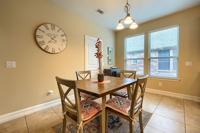 dining space featuring light tile patterned floors