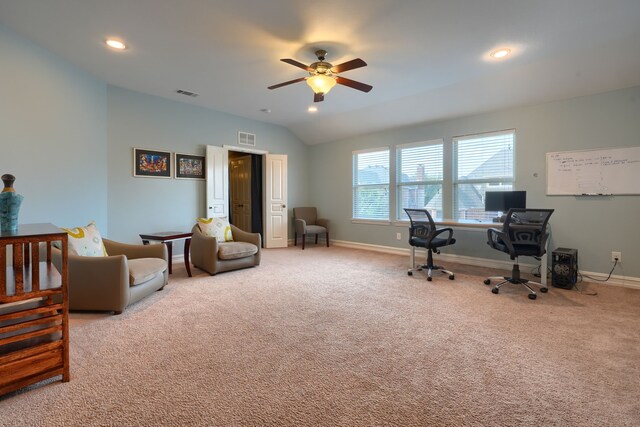 carpeted office with ceiling fan and vaulted ceiling