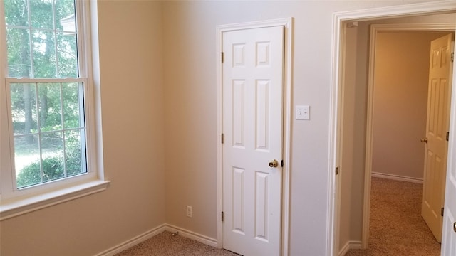 unfurnished room featuring carpet flooring