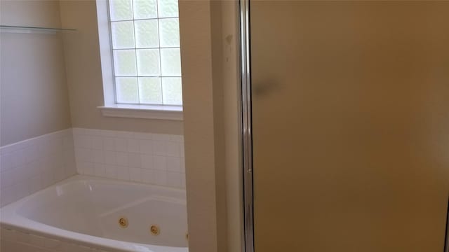 bathroom with separate shower and tub