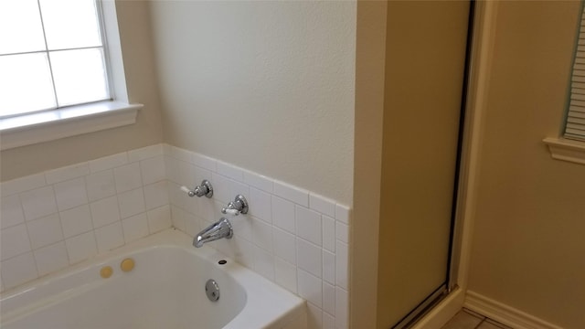 bathroom featuring plus walk in shower