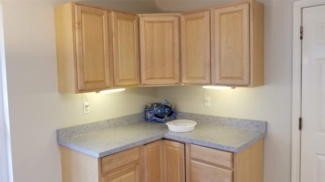 kitchen featuring light brown cabinets