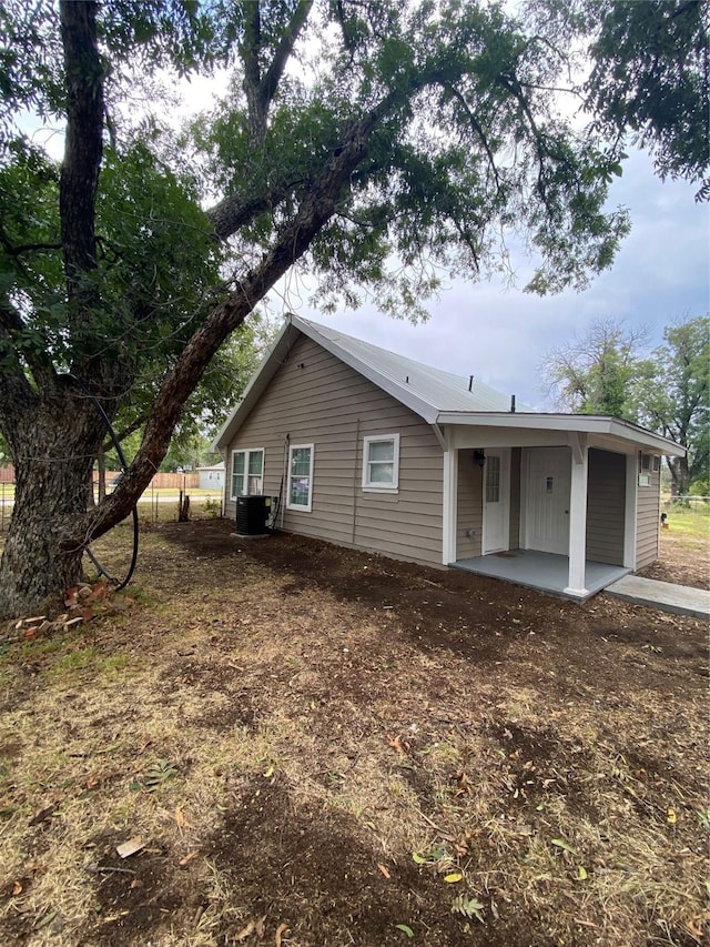 back of house featuring a patio and cooling unit