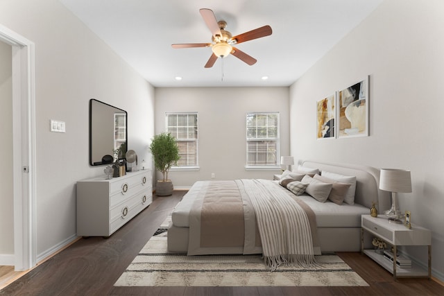 bedroom featuring ceiling fan and dark hardwood / wood-style flooring