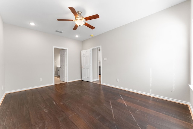 unfurnished bedroom featuring ceiling fan and dark hardwood / wood-style flooring