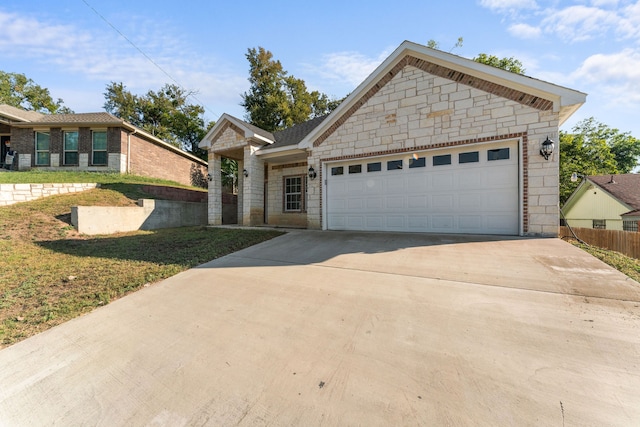 view of front facade with a garage and a front yard