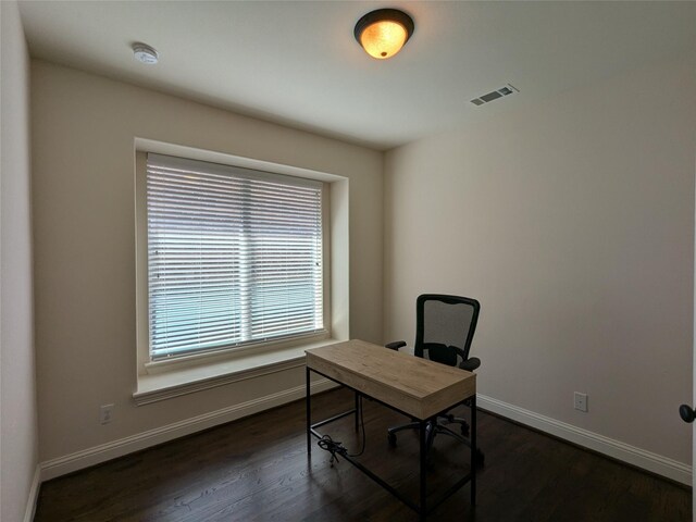 unfurnished living room with dark hardwood / wood-style floors, ceiling fan with notable chandelier, and a towering ceiling