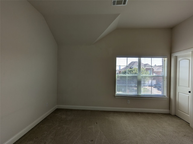 bonus room featuring lofted ceiling and carpet