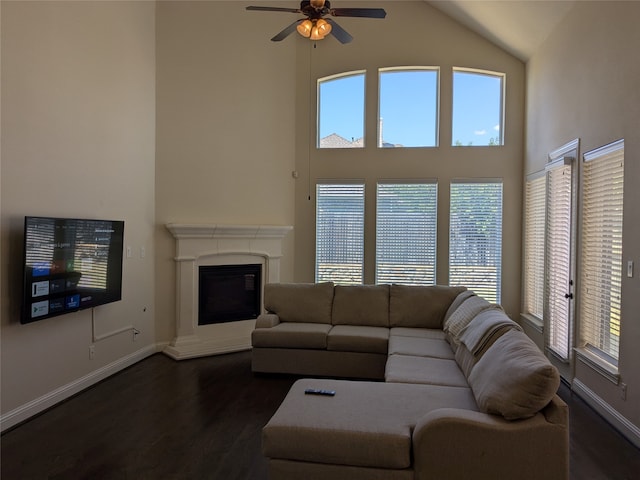 living room featuring high vaulted ceiling, a healthy amount of sunlight, ceiling fan, and dark hardwood / wood-style floors