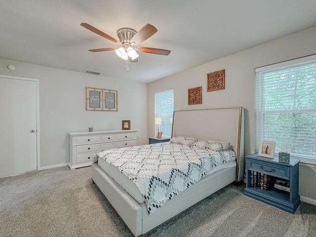 bedroom with light carpet and ceiling fan