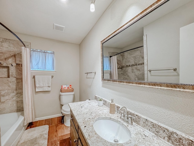 full bathroom with toilet, vanity, and shower / tub combo with curtain