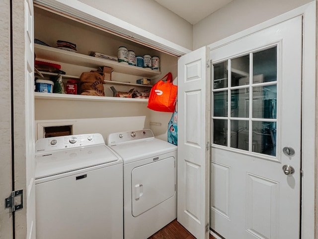 laundry area featuring separate washer and dryer and dark hardwood / wood-style floors