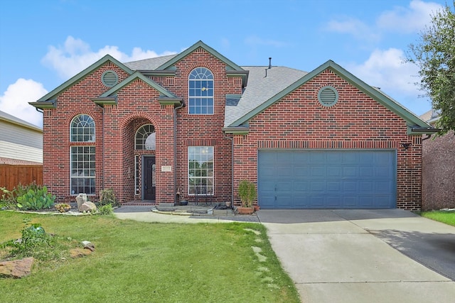 front of property with a garage and a front lawn