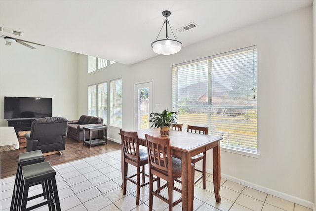 dining space featuring visible vents, baseboards, and light tile patterned flooring