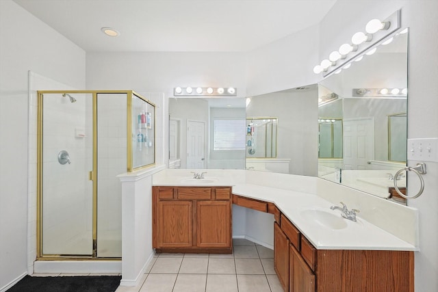 full bath with a shower stall, a sink, and tile patterned floors