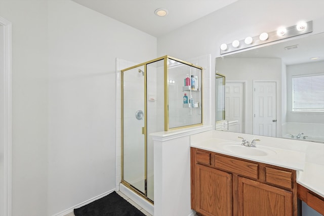 bathroom featuring a stall shower, visible vents, and vanity