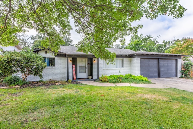 ranch-style house with a garage and a front yard