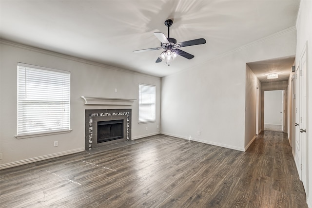 unfurnished living room featuring a fireplace, dark hardwood / wood-style floors, and ceiling fan