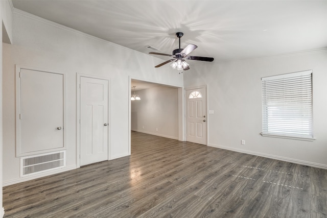 unfurnished room featuring ceiling fan with notable chandelier, ornamental molding, and dark hardwood / wood-style floors