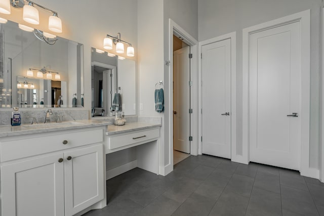 bathroom with tile patterned flooring, decorative backsplash, and vanity