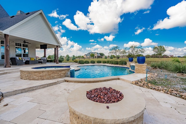 view of pool featuring an outdoor living space with a fire pit, an in ground hot tub, ceiling fan, and a patio