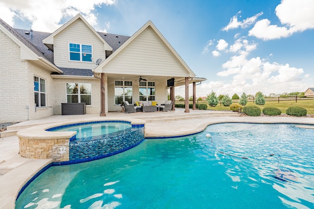 view of pool featuring an outdoor living space, a patio, an in ground hot tub, and ceiling fan